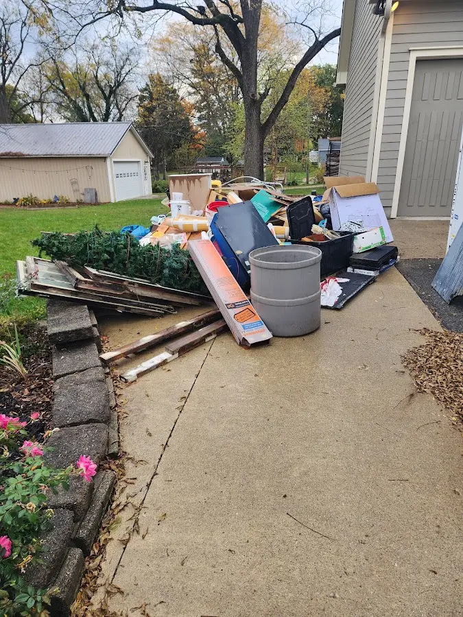 Dumpster being loaded with debris for Residential Dumpster Rental in Spencer